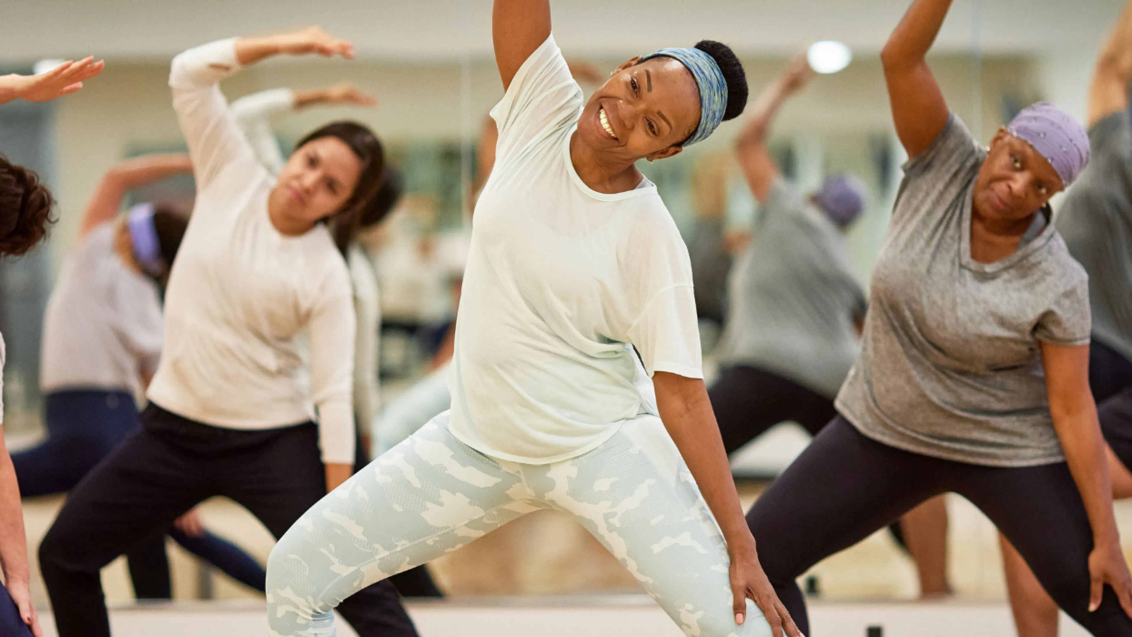Group exercise class with yoga and dance