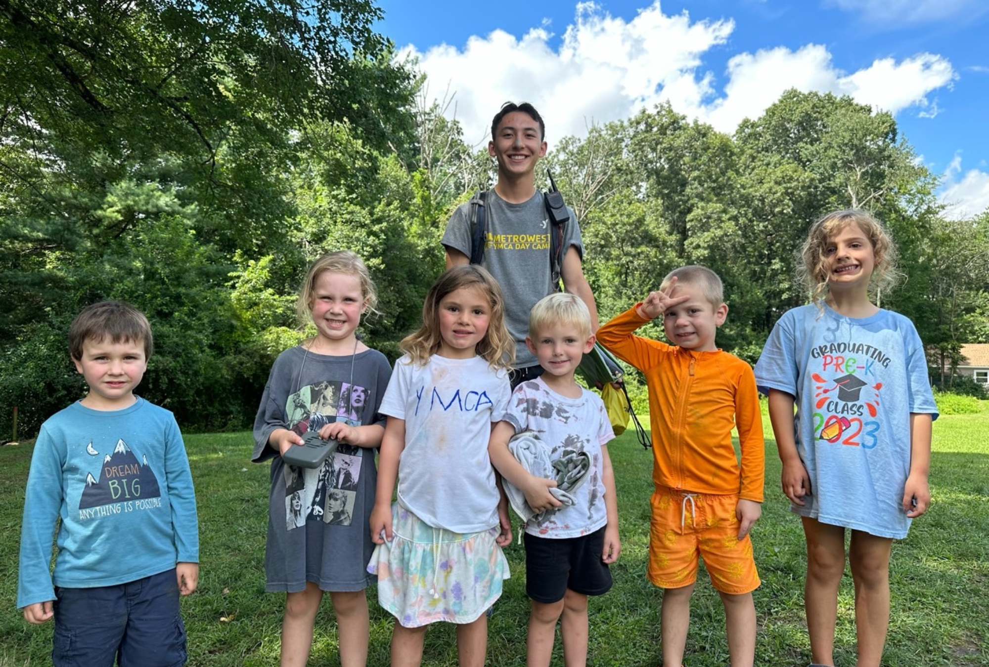 junior campers smile on the sports field