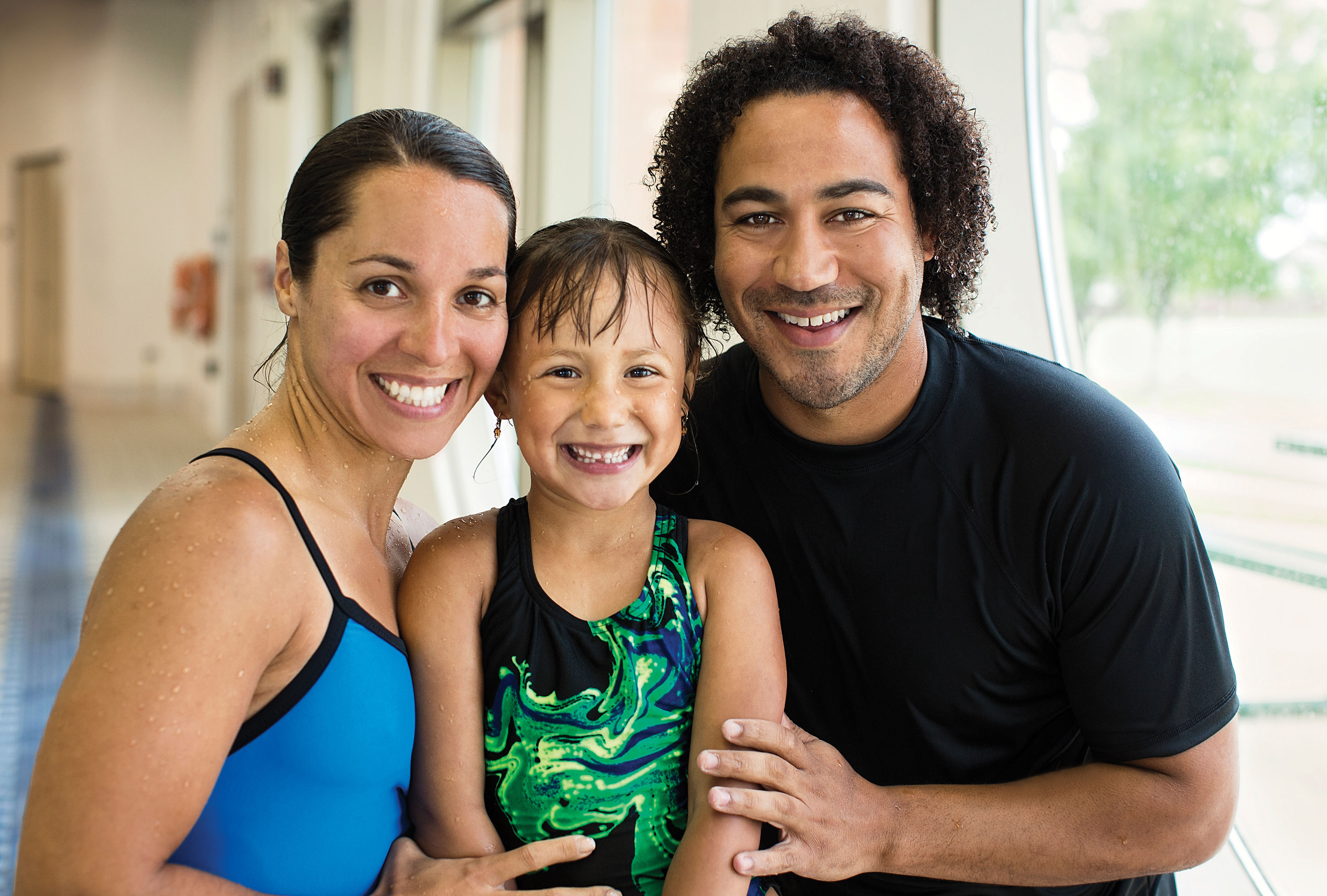 Parents and daughter at the pool