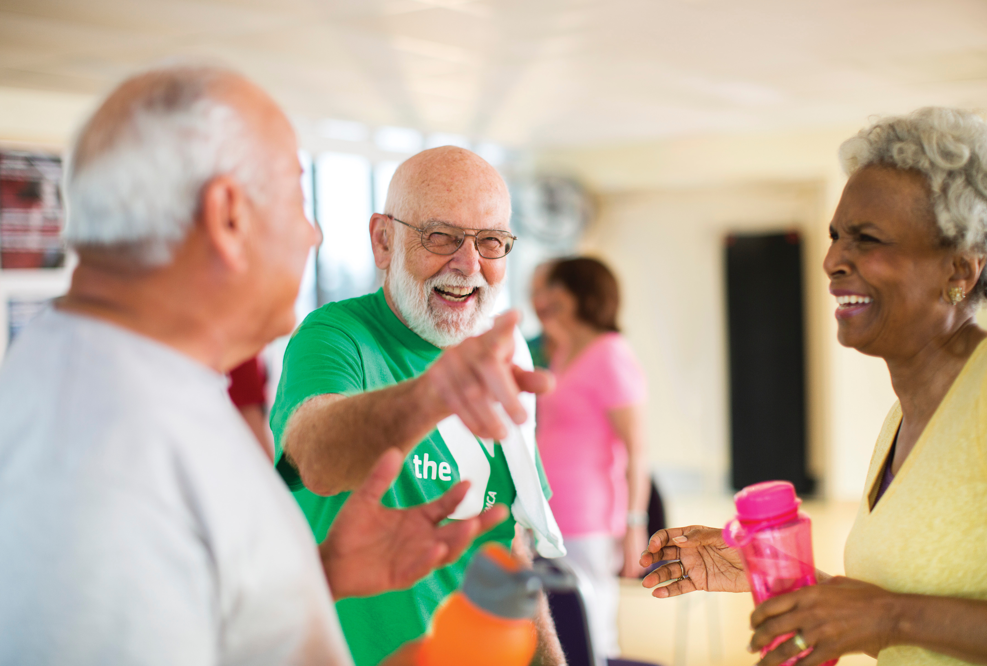 Seniors talk and laugh after fitness class