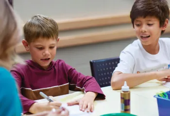 photo of two boys participating in arts and crafts