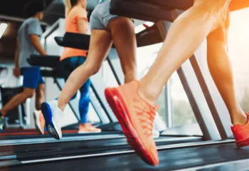 up close image of runners on treadmills