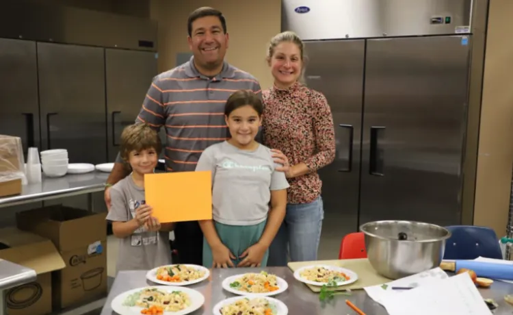 family of four during cooking class