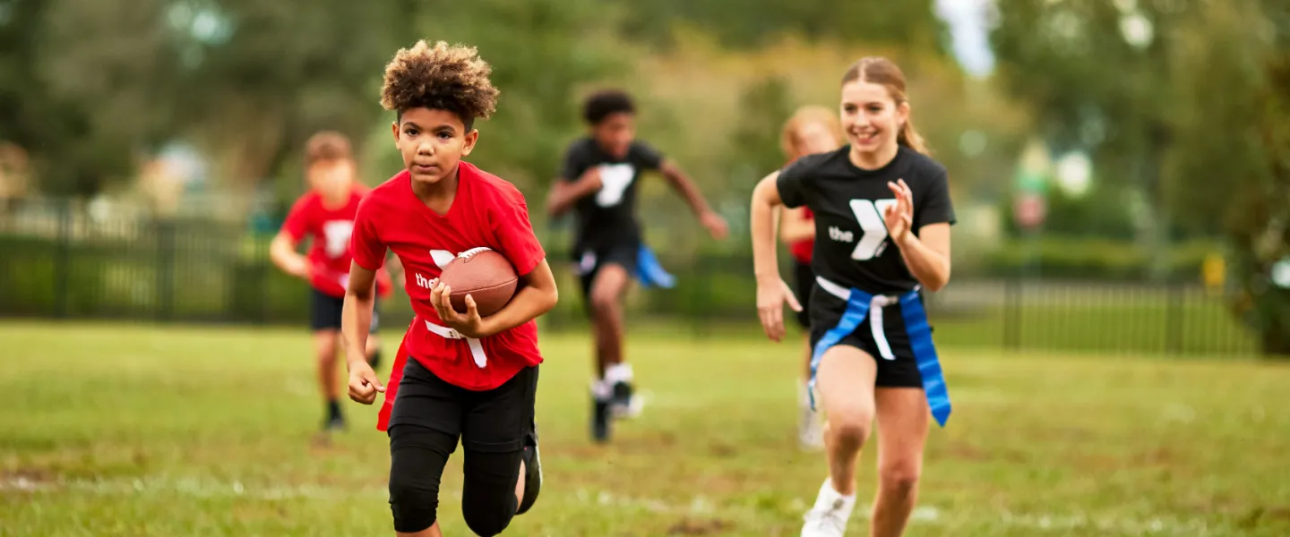 youth playing a game of flag football