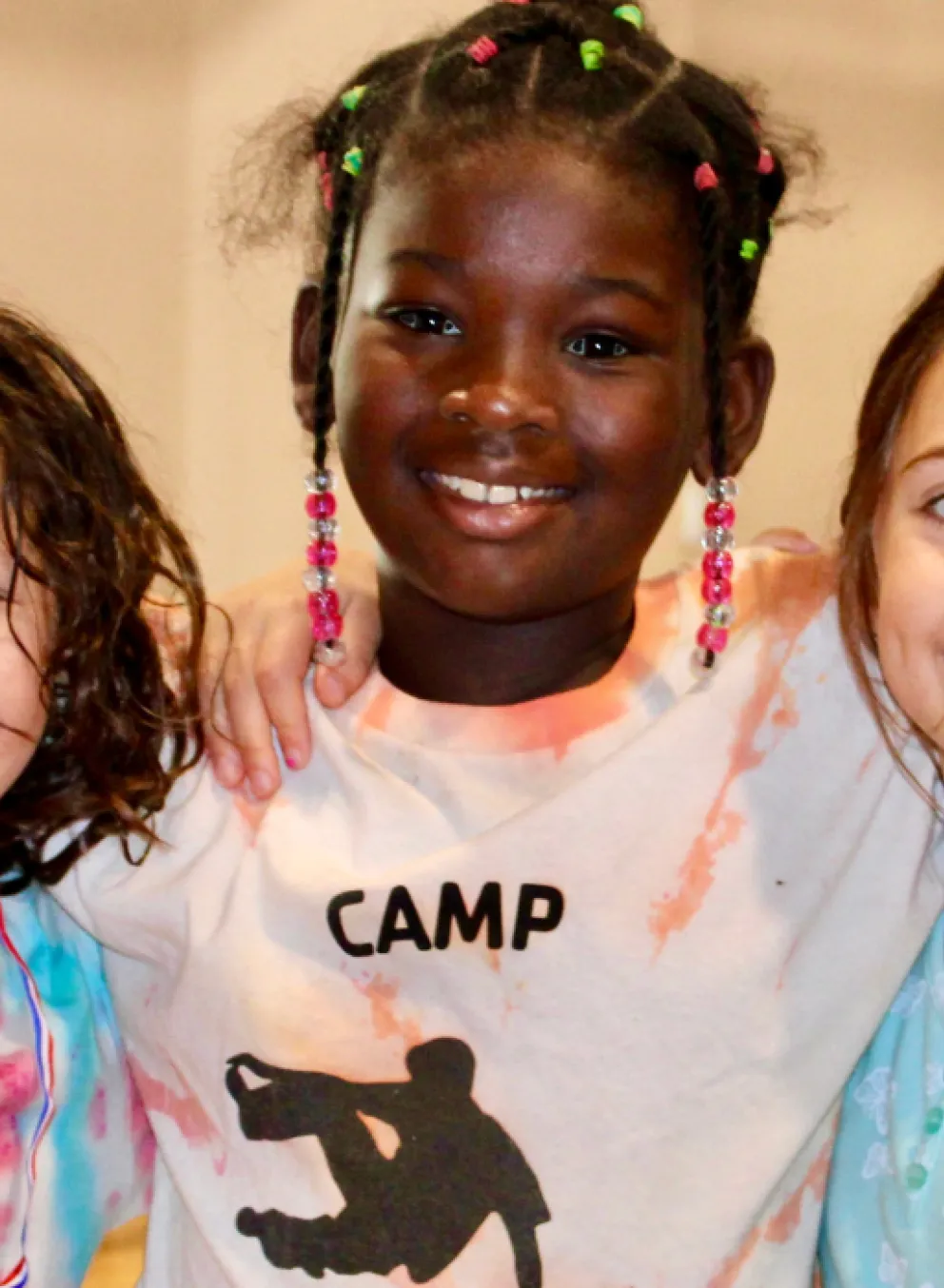 image of three girls smiling at the camera