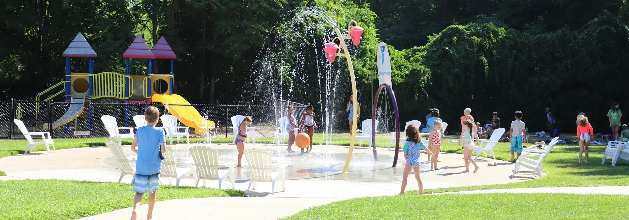 Kida playing at a splash pad