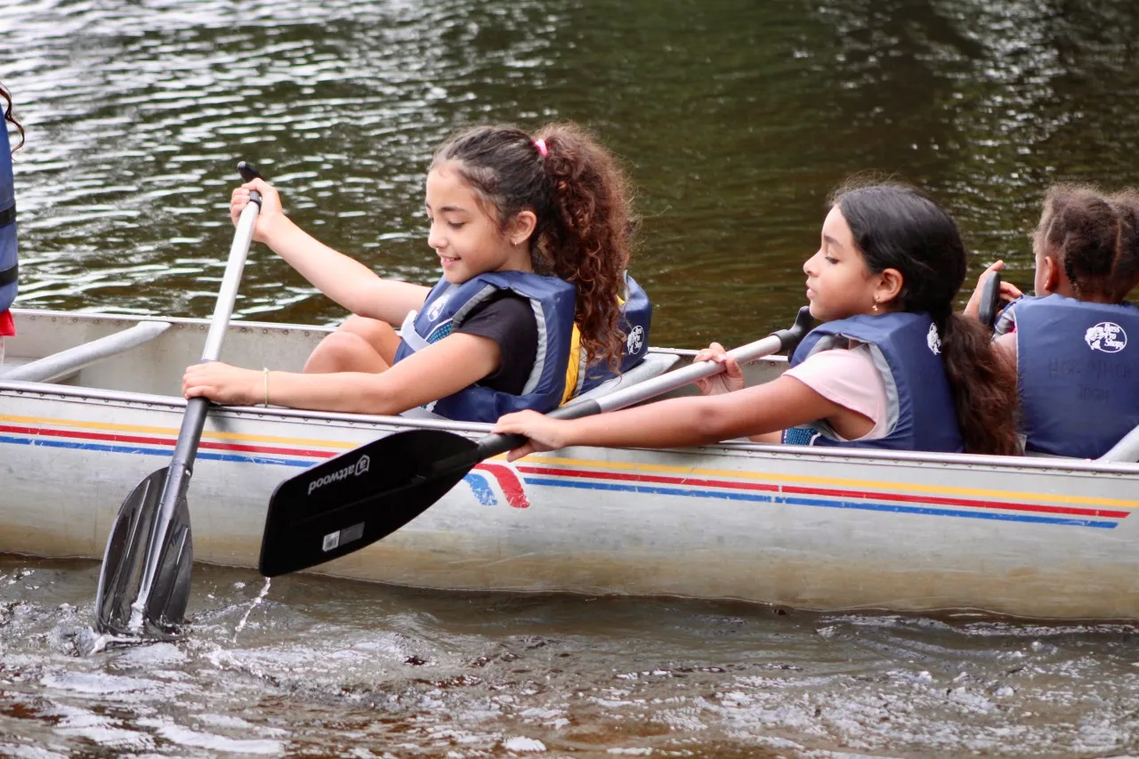 image of young girls in canoe