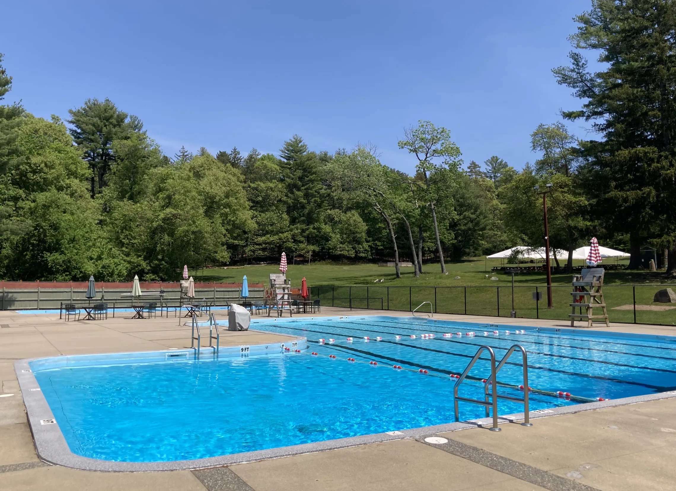 photo of an outdoor pool on a sunny day