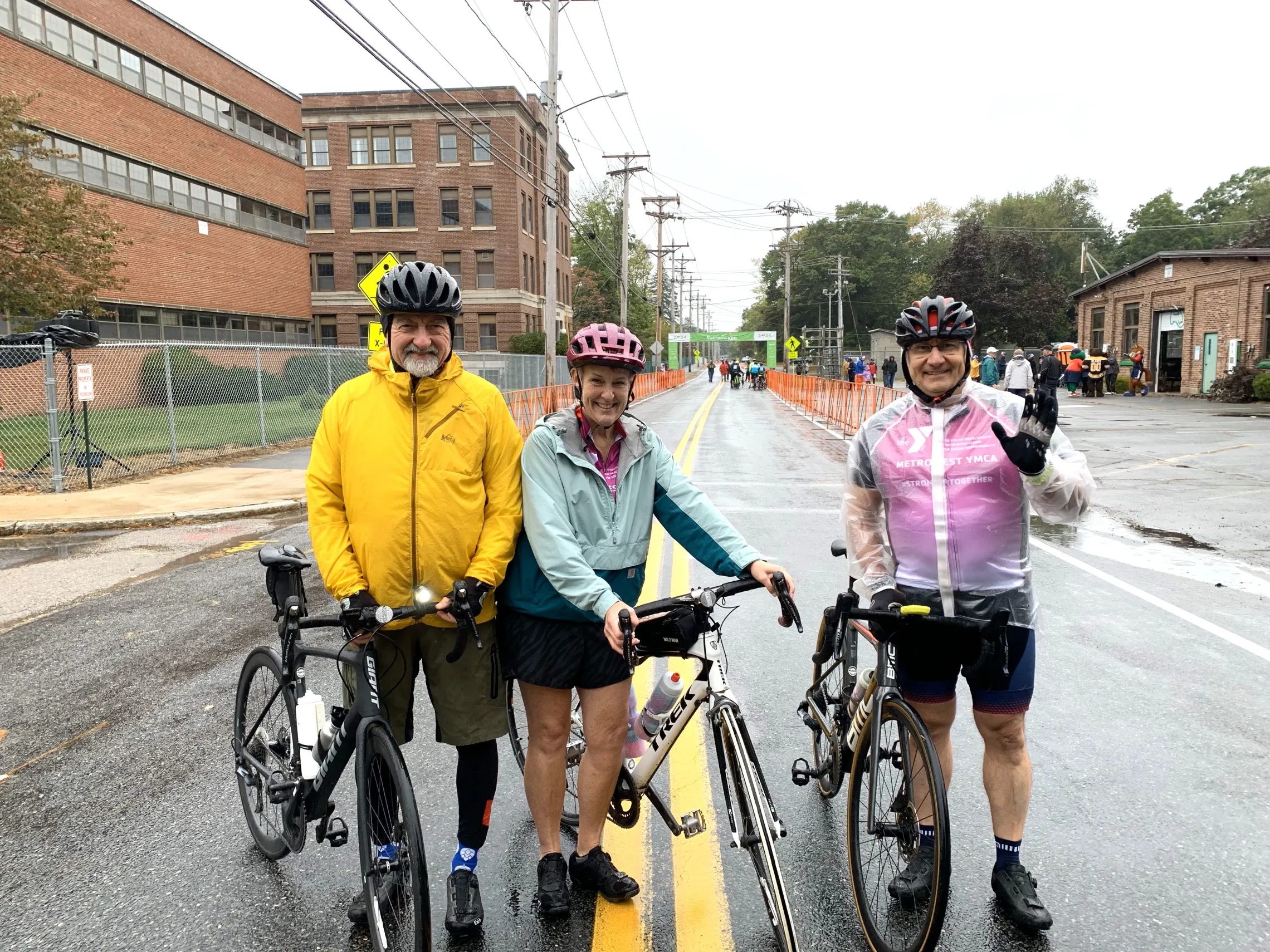 image of three bike riders on a rainy day