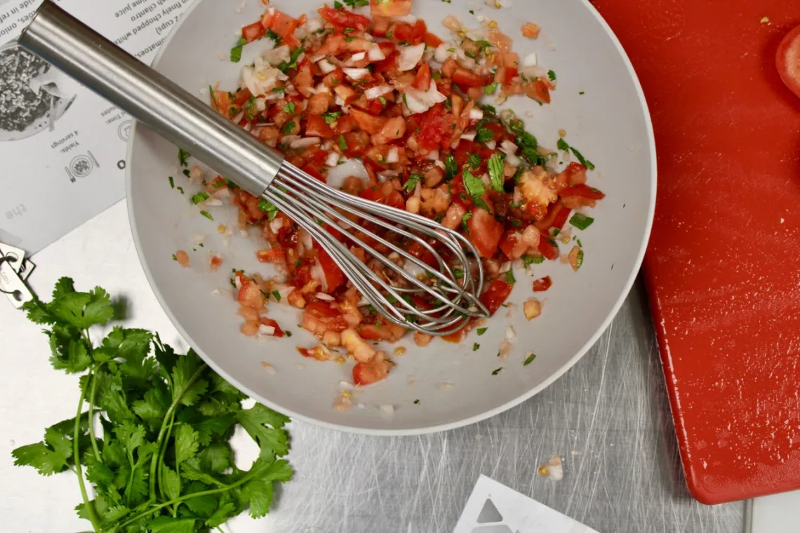 overhead image of a bowl of diced tomatoes