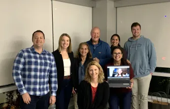 image of a group of people smiling for the camera